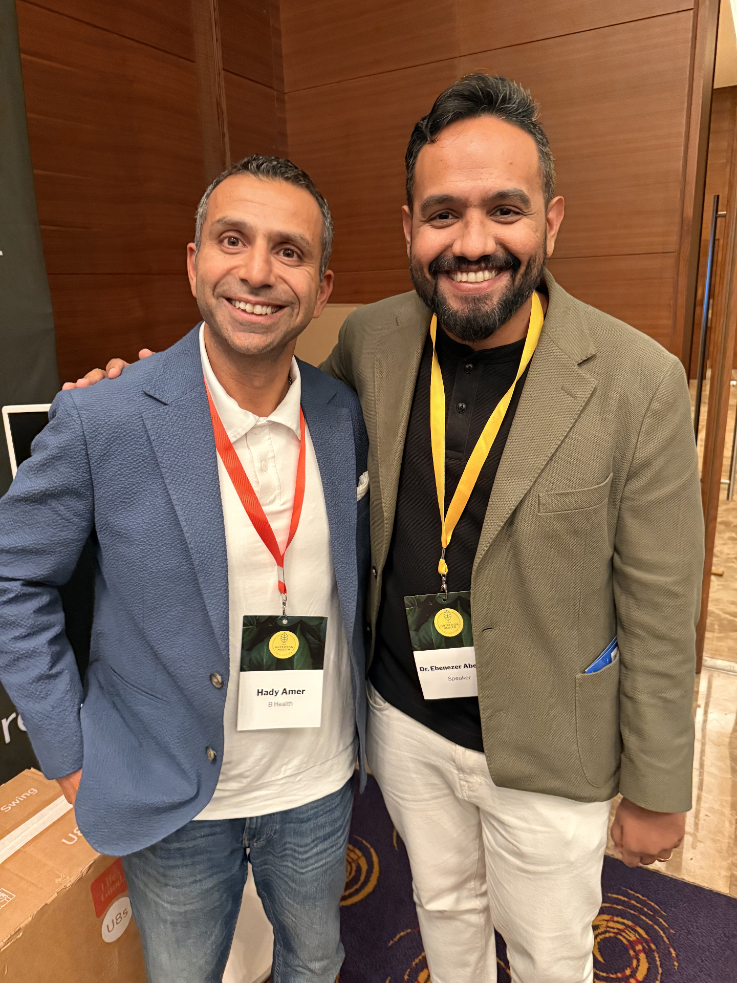 Dr. Ebenezer with a fellow founder at a corporate health event